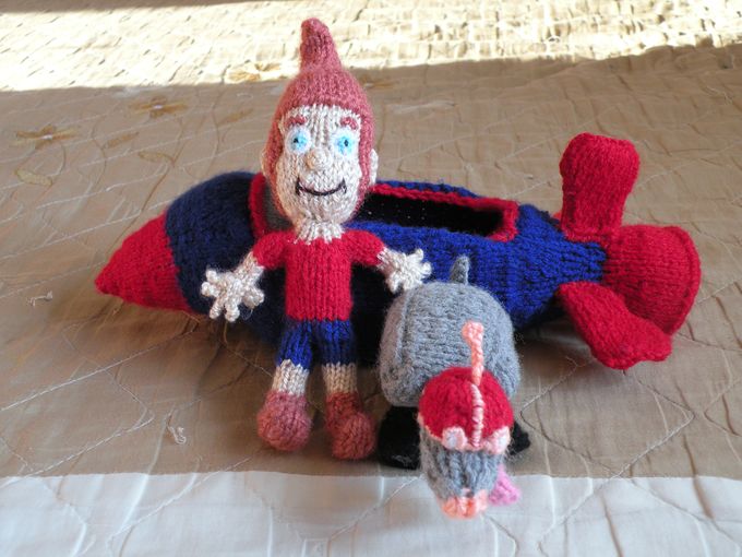 Knitted airplane with characters